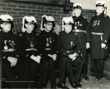 Members of the Knights of Pythias in the uniforms. One member attending is 'Robert Bowlby'. 
