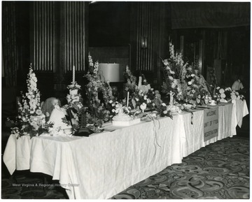 Table is covered with flowers.