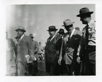 Harry Truman arriving at the Morgantown Airport in Morgantown, West Virginia. On his left is Sheriff Clarence Johnson.