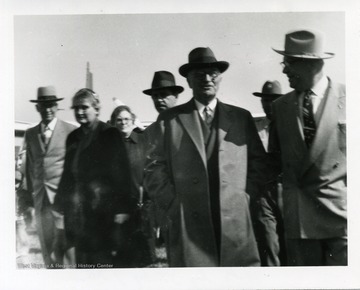 Harry Truman arriving at Morgantown Airport, Morgantown, West Virginia. Sheriff Clarence Johnson is at his left.