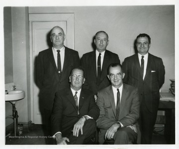 Five Morgantown Businessmen pose for a group photo. First Row: (left to right): J.W. Ruby, Harold Suter. Back Row: (left to right): unknown, Harold Fetty, Sam Chico.