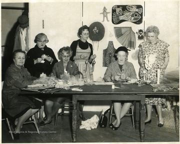 Second from left, standing, Berta Gertrude Plant.  Second from right, seated, Mrs. Rudoph S. Stoyer.