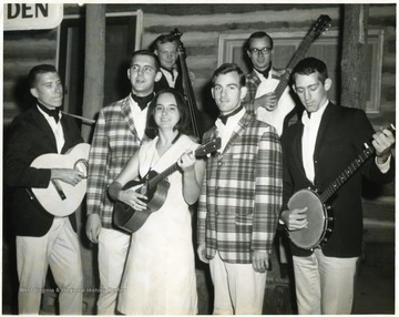At left with guitar is Dick Shuttlesworth; next to him in plaid jacket is Steve Jenkins; other member in plaid jacket is Lee Maust.