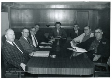 'From left to right: Don Marsteller, Ed Walls, unknown, unknown, Burl Bolyard, Bernard Stenger, unknown, Police Chief Russell L. Singleton.'