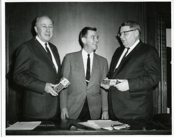 Mayor Arthur Beuhler (left), an unidentified man, and James Ashburn (right.)