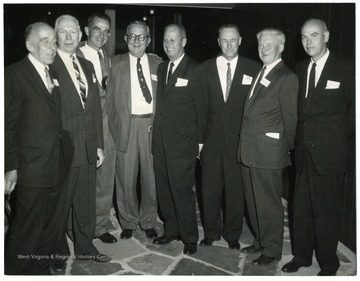 'From left to right:  unknown, unknown, Harold Sutor, unknown, Mr. Payne, Ivan Given, unknown, Chas. Nailler.'
