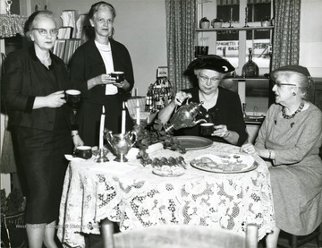 'Far right-Mrs. Nell Leonian second from left- Mrs. Wilson'. 