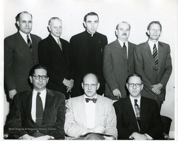 'Left to right: Rev. Roy Benton Hanan, Rev. W. Roy Hashinger, Fr. Eugene A. Schmitt, Rabbi Morri M. Rose, Dr. Earl Core (West Virginia University), Bill Moreland, Bill C. Swartz, and Staunton Cady.'