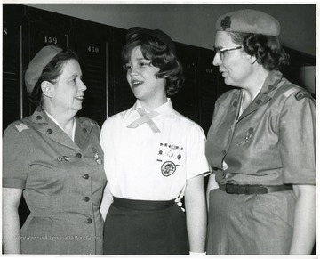 In the center is Sue Seranella, M. H. S. class of 1964.