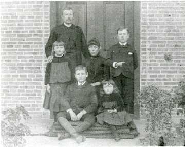 'Mr. Hunter, missionary to China circa 1870s, and wife, Sara Moreland Hunter and family.' 