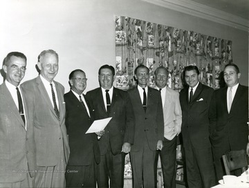Right to left: 'third from left: J. W. Ruby, fourth: Mr. McCartney, fifth: Martin Pirbeck, sixth: Mal Campbell, seventh: Elvis Stahr, eighth: James Coombs'.   
