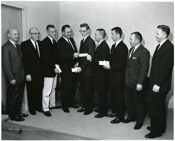 On the far right is Dr. O. Burger of the Ag. School.