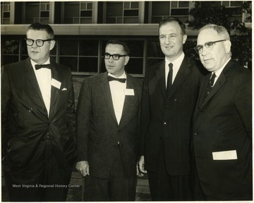 Dean Clark Sleeth is on the far right.  On the far left is Herbert Warden.