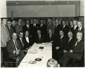 Standing, fourth from right, Chas. Haden; standing, fifth from right, Robert Bennett; standing, fourth from left, Dave Jacobs; standing, left, John Clarkson; seated, fourth from right, Dyke Raese; and seated, second from right, Harold Suter.