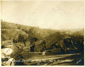 Crowd of people looking at the destroyed fan and boiler house after Monongah Mine explosion. Note: image is taken from the original print donated to the West Virginia Collection.