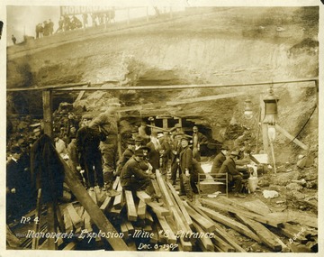 Men sitting and standing near the entrance to mine number 8. Note: image is taken from the original print donated to the West Virginia Collection.