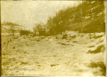 Frozen Monongahela River in the winter. House along the river. 'E. Ralph Clear, for good lighting-- see clear'