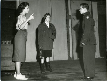 Morgantown High School rehearsal for Wilder's play 'By the Skin of Our Teeth'.  In order from left to right, the people in the photo are Marsha Sanders, Donna Crisswell, and Jim Roberts.