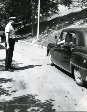 Officer Hughes directs motorists on a busy Morgantown street.