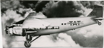 Writing on the aircraft includes, " TAT, Transcontinental Air Transport Inc.," "City of Columbus" and "Ford Tri-Motor".