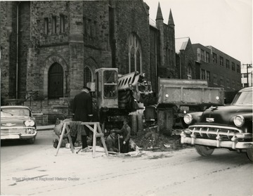 Repairing Willey Street in front of Wesley Methodist Church.