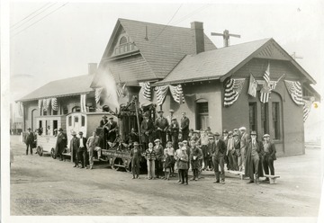 Passengers are waiting outside the Baltimore and Ohio Railroad Depot Station in Morgantown, West Virginia.