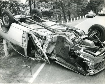 A car accident where the car was totaled and flipped upside down. 