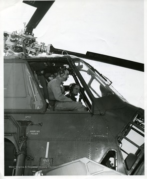 '1-0187-7/SE 57: Italy. Southern European Task Force troops are presently engaged in their first maneuver of 1957 'Exercise Green Epoch'. At the controls of one of SETAF's new H-34 helicopters are Captain William M. Strawn, Morgantown, (left), Opns Officer of 202nd Army Aviation Co., and Captain Joe B. Gibson, Exec. Officer of the 202nd;; Please credit the U.S. Army Photograph. Publication of this photograph is not authorized unless approved for release by a public information office at any army activity or installation and so noted hereon. Its used in commerical advertisement must be approved by the public information division, office of the chief of information and education, Department of the Army, the Pentagon, Washington 25, D.C.'