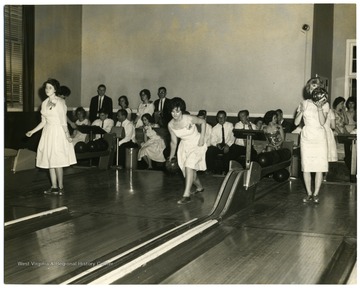 Triad Bowling Party after High School Graduation at Old Mountainlair.  Bowling far left is Jane McGinnis, at far right, Nancy Conrad.  Student visible in the background at left are Mary Harbert, Albert Lakatos, Don Ayresman, and Judy Helmick.