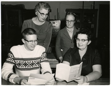 Back row, left to right, Georgia Smith, Math; Mary Whitman, Math.  Front Row, left to right, John Gwynn (MHS 1961, Princeton, 1965); Iris McClure, Physics.