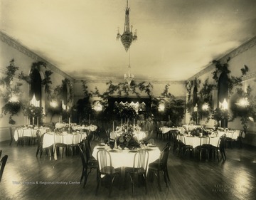 Print number 929. Several tables are decorated in the Hotel Morgan Ballroom in Morgantown, West Virginia.