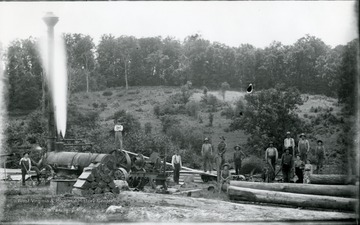 Workers pose on equipment of the United Shingle and Lumber Company Saw Mill near Cyprus Groves (?)