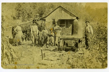 'Asberry Jackson Mayfield (1846-1927) at far right and family making molasses outside their home in Wetzel County, West Virginia.'