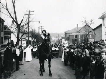A parade on Beechurst Avenue looking North.