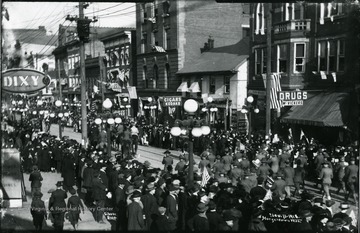 People gather to see the Armistice Day Parade on High Street.
