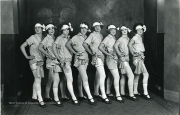 Eight female dancers in line for a portrait.