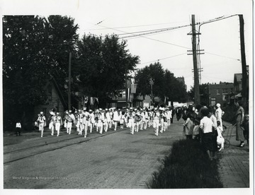Band members march in a political parade in support of John W. Davis, on East Pike near the intersection of Park Avenue in Clarksburg, West Virginia.