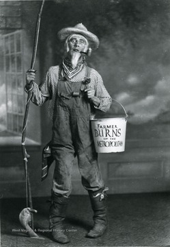 Man in a costume portraying Farmer Burns.