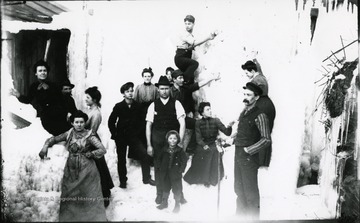 Strange arrangement of people in what appears to be ice and snow.