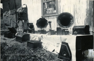 Antique phonographs and other musical items collected by Otis B. Zirkle sitting on a table for diplay.