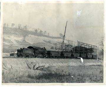 People are unloading materials from Engine Number 1706 in Barbour County, West Virginia.