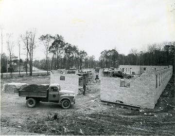 Men working on a new building at Camp Carver.