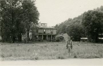 Alexander McCausland stands in front of his home. He was the son of Confederate General John McCausland. 