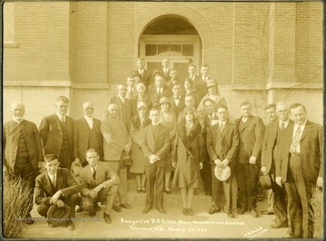 Group portrait of Evangelist B. M. Rollins, Choir, Minister and Assistants in front of a church on March 10-23, 1930. 'W. Va. Photo Company, Thomas Studio, Thomas W. Va.' 'Myrtle S. Arbogast'