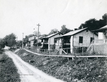 A row of miner's homes line a road in Harrison County.