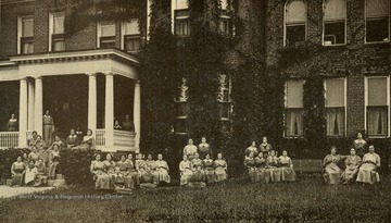 Female inmates seated outside Jones Cottage.