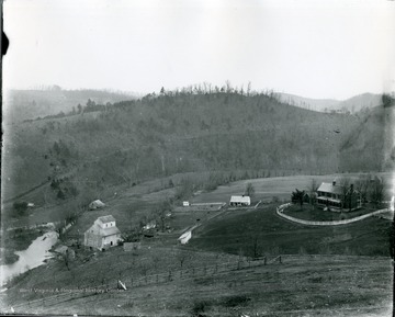 View of three buildings on the land of a large farm north of Alderson, W. Va.