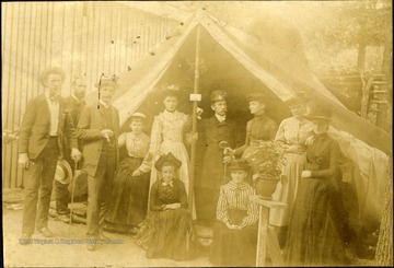 View of a group of people gathered at the entrance of a large canvas tent in Greenbrier county, W. Va.