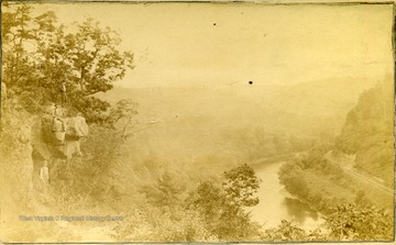View of men sitting on the rocks at Rebel's View looking east in Greenbrier County.