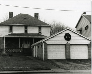 A house and garage are decorated for Christmas in the Old Town District in New Cumberland in Hancock County, West Virginia.